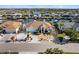 An aerial view of a beautiful one-story home with a two-car garage and waterfront access at 818 Golf Island Dr, Apollo Beach, FL 33572