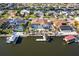 Beautiful aerial shot of a home on a canal, boasting a pool, screened enclosure, and private boat dock at 818 Golf Island Dr, Apollo Beach, FL 33572