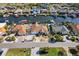 Overhead view of waterfront properties with boat docks and well-manicured yards in a suburban neighborhood at 818 Golf Island Dr, Apollo Beach, FL 33572