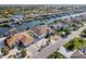 Extensive aerial view showcasing waterfront homes each with private docks, pools, screened enclosures, and well-kept landscaping at 818 Golf Island Dr, Apollo Beach, FL 33572