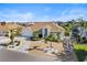 An aerial view of a beautiful one-story home with a two-car garage and waterfront access at 818 Golf Island Dr, Apollo Beach, FL 33572