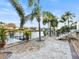 This backyard features a custom patio with a dock and waterfront access at 818 Golf Island Dr, Apollo Beach, FL 33572