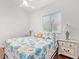 Bright bedroom showcasing colorful bedding, a ceiling fan, and ample natural light at 818 Golf Island Dr, Apollo Beach, FL 33572