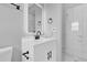 Bathroom featuring modern vanity, mirror and walk in shower at 8549 Oakhurst Rd, Seminole, FL 33776