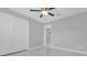 Bedroom featuring tile floors, ceiling fan, and closet at 8549 Oakhurst Rd, Seminole, FL 33776