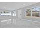 Modern living room showcasing tile floors, freshly painted walls and large windows for natural light at 8549 Oakhurst Rd, Seminole, FL 33776