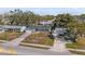 Nice street view showing the house and other homes in the neighborhood at 8549 Oakhurst Rd, Seminole, FL 33776