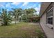 Spacious fenced backyard with pond at 289 Whisper Lake Rd, Palm Harbor, FL 34683