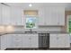 Bright kitchen with stainless steel appliances and white subway tile backsplash at 289 Whisper Lake Rd, Palm Harbor, FL 34683