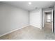 Bedroom featuring neutral carpet, a closet with sliding doors, and access to other rooms at 2764 Emory Sound Pl, Brandon, FL 33510