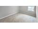 Bedroom with neutral carpet and a window allowing natural light at 2764 Emory Sound Pl, Brandon, FL 33510