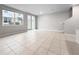 Bright living room with tile flooring and sliding glass doors that provide access to the outdoors at 2764 Emory Sound Pl, Brandon, FL 33510