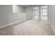 Spacious loft area with neutral carpet and walls, providing flexible living space at 2764 Emory Sound Pl, Brandon, FL 33510