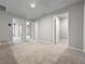 Loft area with carpet, multiple doorways leading to other rooms, and neutral walls at 2764 Emory Sound Pl, Brandon, FL 33510