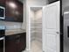 Kitchen pantry with adjustable metal shelving units provides ample space for food and storage at 2764 Emory Sound Pl, Brandon, FL 33510