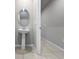 Half bathroom with a pedestal sink, mirror, neutral paint, and tile floors at 2764 Emory Sound Pl, Brandon, FL 33510