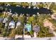 Aerial view of waterfront property with lush greenery and private boat docks at 3225 Bluff Blvd, Holiday, FL 34691