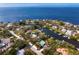 Aerial view of waterfront homes showcasing canals and open water at 3225 Bluff Blvd, Holiday, FL 34691