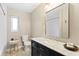 Elegant bathroom with marble vanity, gold fixtures, and stylish tile floor at 3225 Bluff Blvd, Holiday, FL 34691