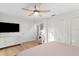 Well-lit bedroom with a light color scheme and hardwood floors at 3225 Bluff Blvd, Holiday, FL 34691