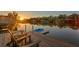 Stunning sunset view from the private dock with seating and kayak launch at 3225 Bluff Blvd, Holiday, FL 34691