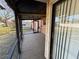 View of the back porch leading to the grassy yard through a sliding glass door at 3923 W Bay View Ave, Tampa, FL 33611