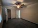 Bedroom view featuring a ceiling fan, a small closet, and natural light from the window at 3923 W Bay View Ave, Tampa, FL 33611