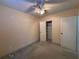 This bedroom has a ceiling fan and a door that leads to a closet with shelving at 3923 W Bay View Ave, Tampa, FL 33611