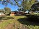 View of the front yard and the home's exterior at 3923 W Bay View Ave, Tampa, FL 33611