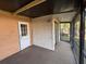 Enclosed patio features a screen and access door to the outside at 3923 W Bay View Ave, Tampa, FL 33611