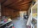 Interior view of the shed with shelving, work table, and a variety of storage items at 3923 W Bay View Ave, Tampa, FL 33611