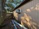 Side view of the shed, showing a window air conditioning unit at 3923 W Bay View Ave, Tampa, FL 33611