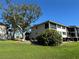 A charming condo with a cozy, screened porch overlooking a lush lawn and mature tree at 1813 Mariner Dr # 152, Tarpon Springs, FL 34689
