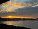 Stunning sunset view over the bay, with the sun setting behind the buildings on the horizon at 1813 Mariner Dr # 152, Tarpon Springs, FL 34689