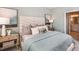 Comfortable bedroom featuring a stylish headboard and soothing color palette at 23819 Collina Way # 011101, Port Charlotte, FL 33980
