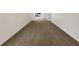 Spacious carpeted bedroom with ample natural light, offering a serene and comfortable environment at 4508 Golfwood Blvd, Tampa, FL 33634