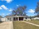 Beautiful single-story home featuring a red brick accent and a well-maintained lawn, blending style with comfort at 4508 Golfwood Blvd, Tampa, FL 33634