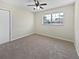 Cozy bedroom with carpet, a window with natural light and a closet at 7013 Doreen St, Tampa, FL 33617