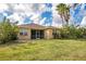 Backyard view of the home showing well maintained lawn and landscaping at 11530 57Th Street E Cir, Parrish, FL 34219