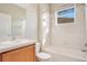 Bright bathroom featuring a shower-tub combo and vanity with storage at 11530 57Th Street E Cir, Parrish, FL 34219