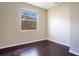 Clean bedroom showcases modern dark floors and large bright window at 11530 57Th Street E Cir, Parrish, FL 34219