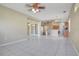 Expansive living room featuring bright tile floors, light walls, and sliding glass doors at 11530 57Th Street E Cir, Parrish, FL 34219