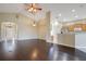 Bright living room featuring beautiful wood floors, a vaulted ceiling, and stylish light fixtures at 11530 57Th Street E Cir, Parrish, FL 34219