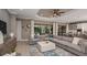 Open-concept living room with views of outdoor dining area at 29930 Radice Ct, Wesley Chapel, FL 33545