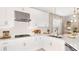 Bright and airy kitchen featuring white cabinetry, subway tile backsplash, and stainless steel appliances at 742 Steel Dr, Apollo Beach, FL 33572