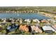 An aerial view of houses nestled by the water with lush landscaping at 6977 74Th Street E Cir, Bradenton, FL 34203