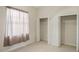 Bedroom features a window and two open closets at 6977 74Th Street E Cir, Bradenton, FL 34203