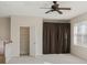 Spacious bonus room featuring neutral walls, ceiling fan, and natural light from the window at 6977 74Th Street E Cir, Bradenton, FL 34203