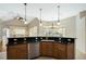 Kitchen view featuring granite counters, stainless steel dishwasher, and ample cabinet space at 6977 74Th Street E Cir, Bradenton, FL 34203