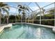 A beautiful swimming pool enclosed by a screen, providing a private backyard retreat at 6977 74Th Street E Cir, Bradenton, FL 34203